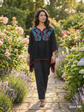 This is a sophisticated Black Sleeveless Midi Dress with Metallic Embroidery, styled for an elegant evening look.